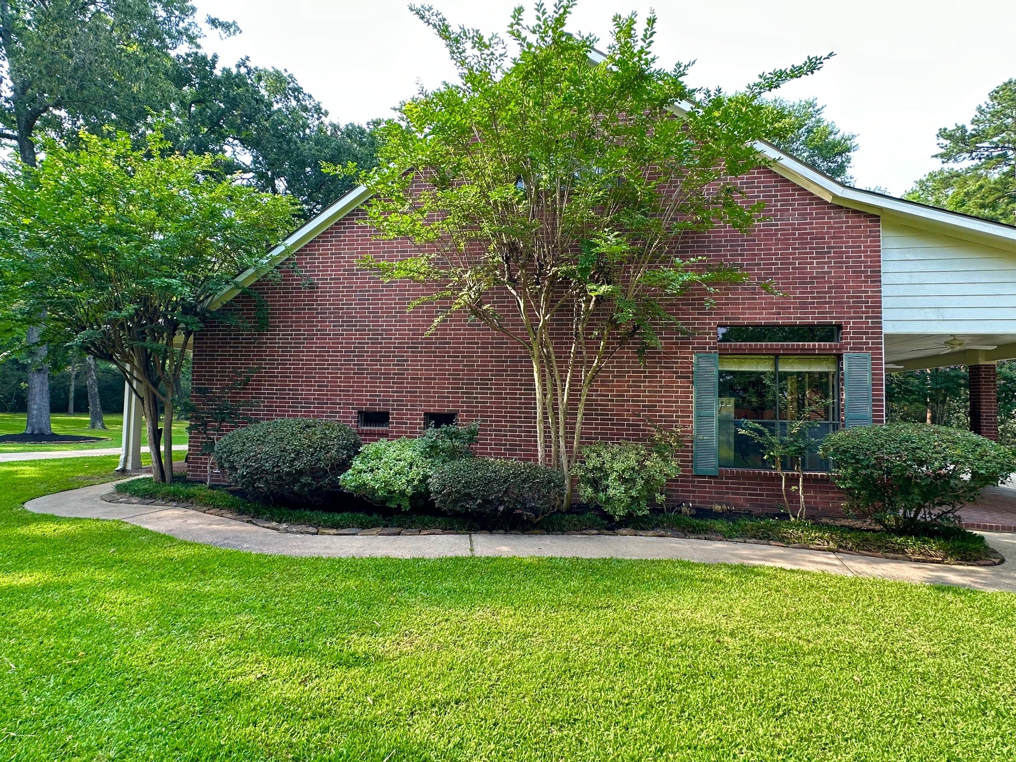 15567 Old Conroe Road Conroe, TX 77384 - Photo 9 of 31 a view of a house with backyard and garden