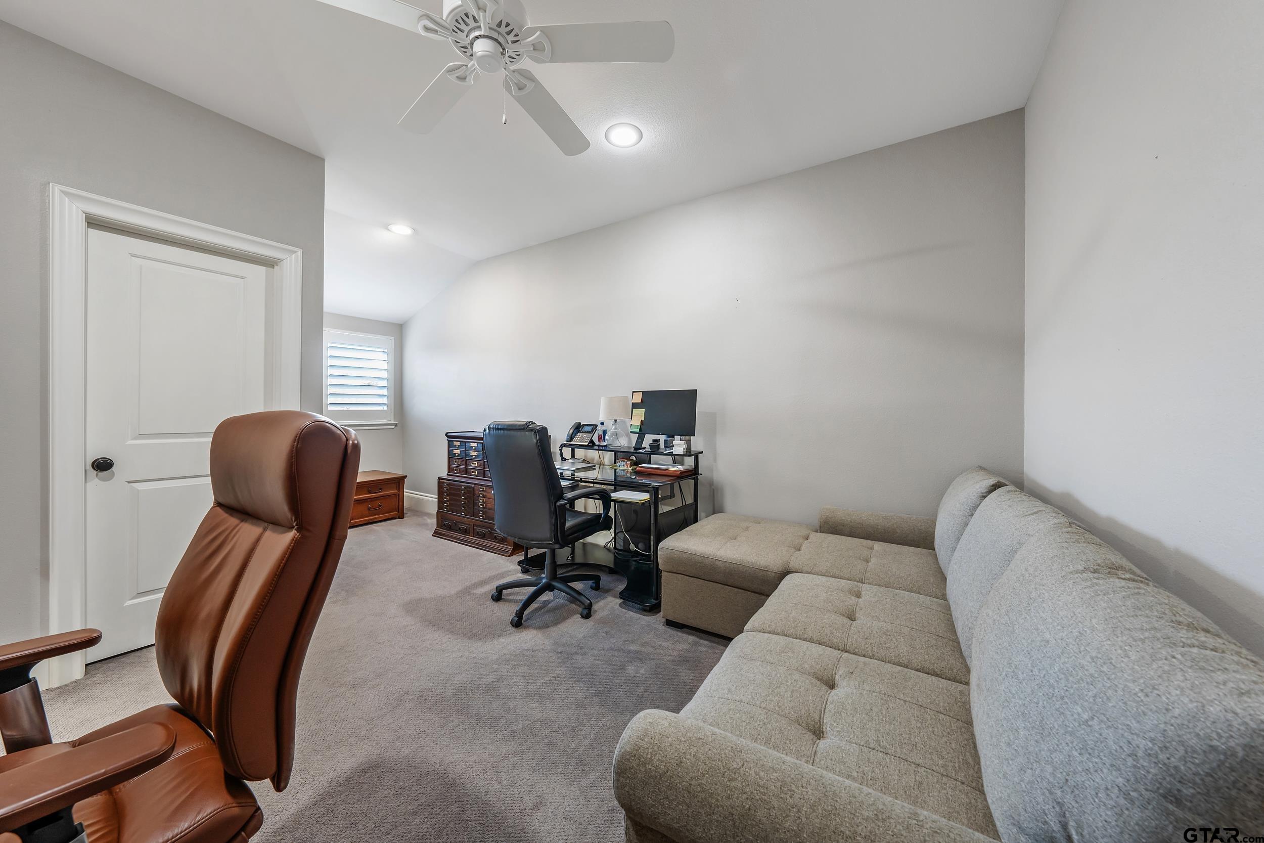 4535 Triggs Trace Tyler, TX 75709 - Photo 29 of 46 a view of a livingroom with workspace and a couch
