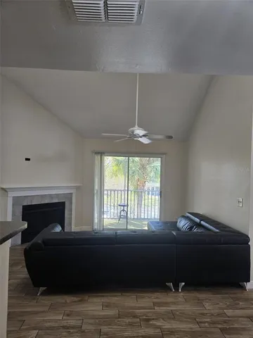 a living room with a bed furniture and a window