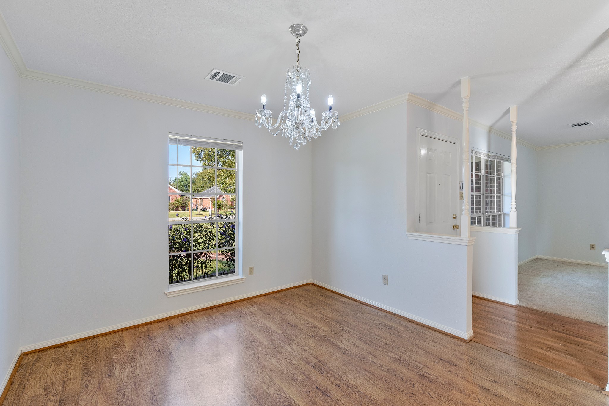 8018 Holiday Lane Houston, TX 77075 - Photo 7 of 42 wooden floor in an empty room with a window