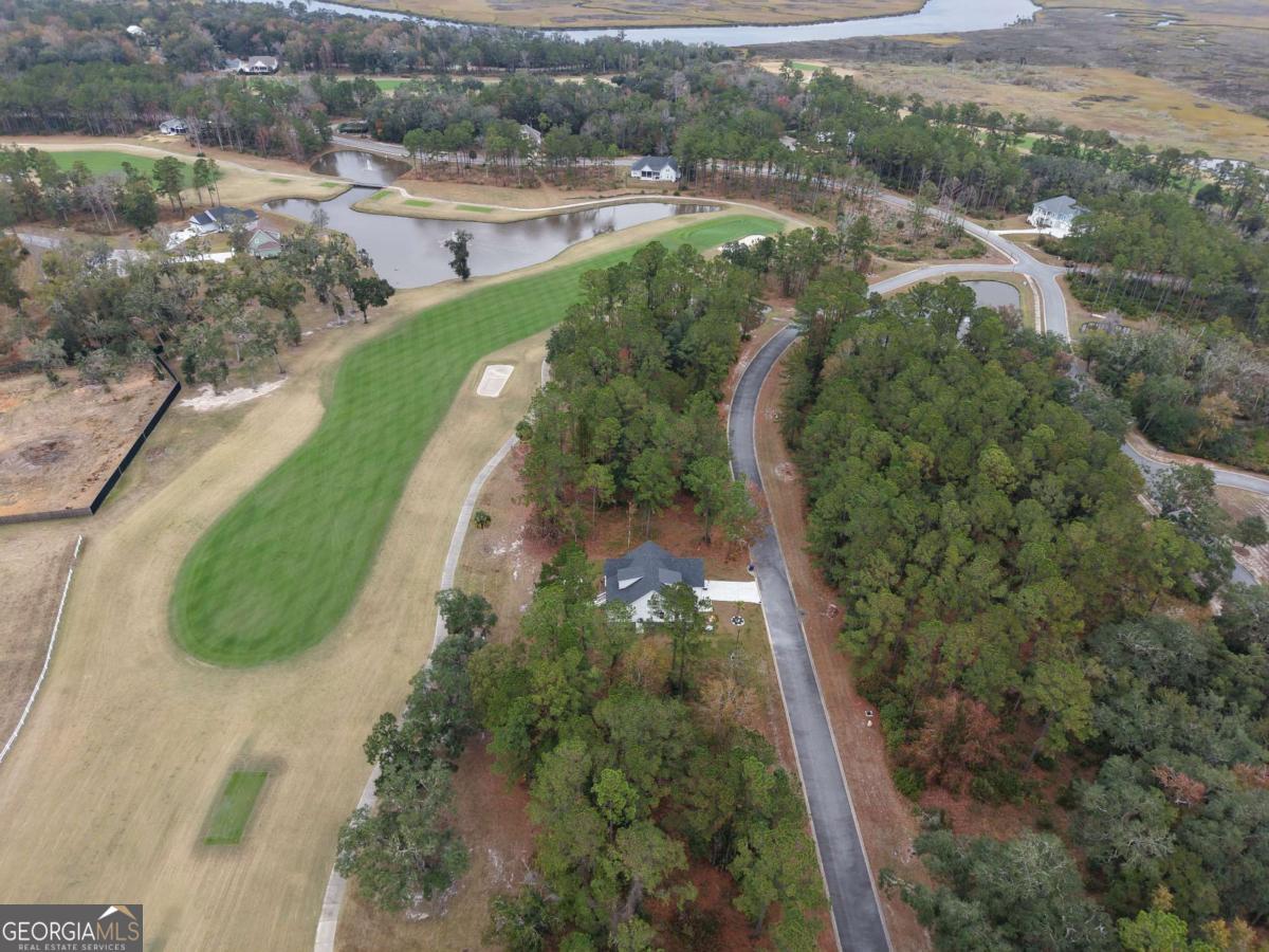 Lot 11 Navigator Way Waverly, GA 31565 - Photo 7 of 31 an aerial view of a house with a yard and lake view