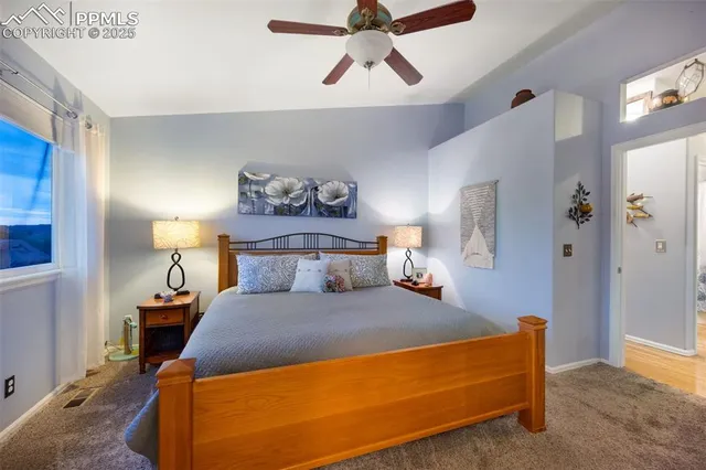 a bedroom with a bed and lamp