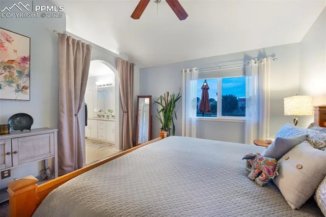 a bed room with a bed and a window