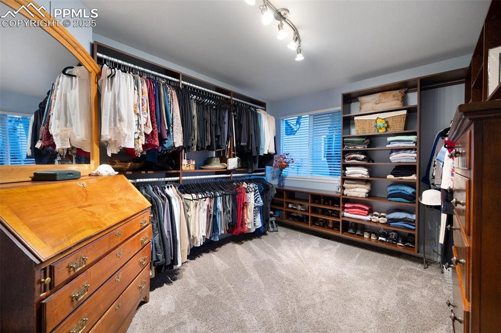 6370 Perfect View Colorado Springs, CO 80919 - Photo 21 of 49 a view of walk in closet with clothes and shoes
