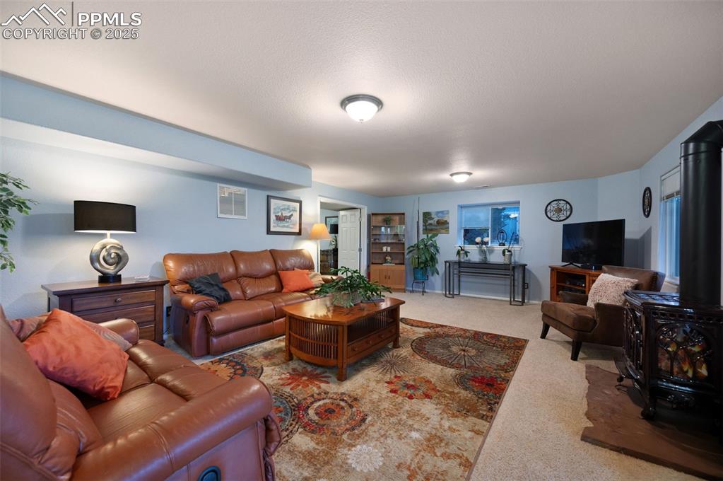 6370 Perfect View Colorado Springs, CO 80919 - Photo 26 of 49 a living room with furniture and a flat screen tv