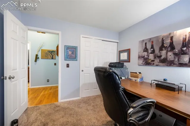 a workspace with furniture and wooden floor