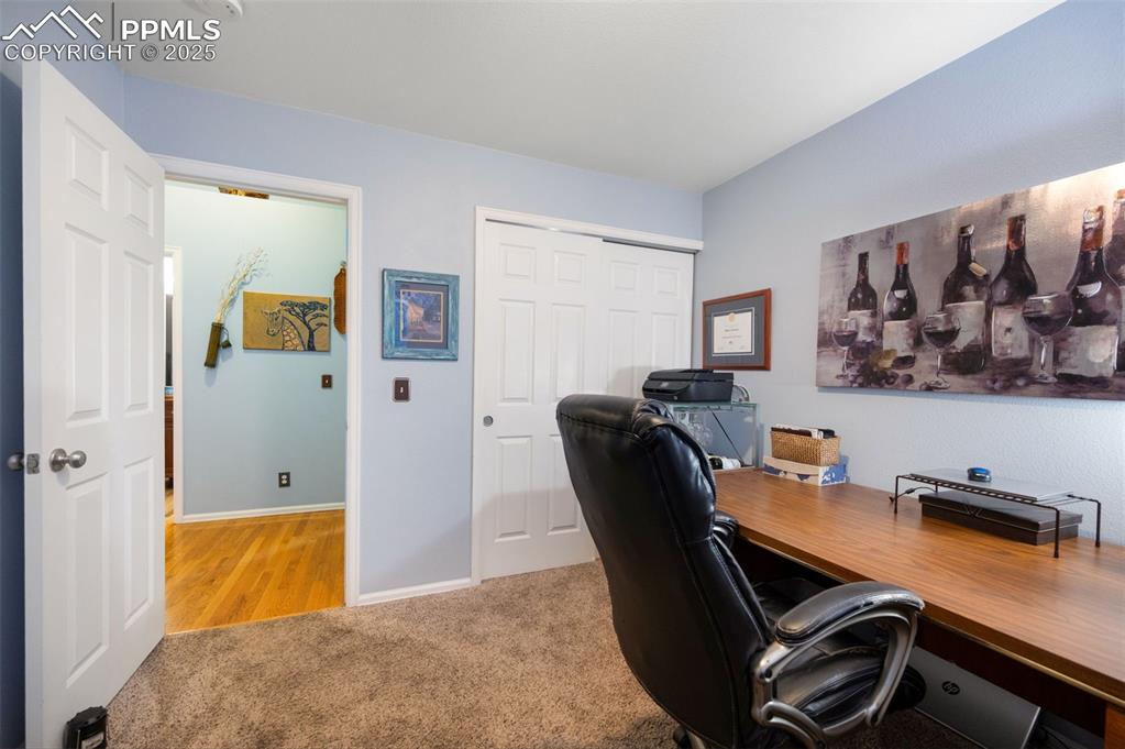 6370 Perfect View Colorado Springs, CO 80919 - Photo 31 of 49 a workspace with furniture and wooden floor