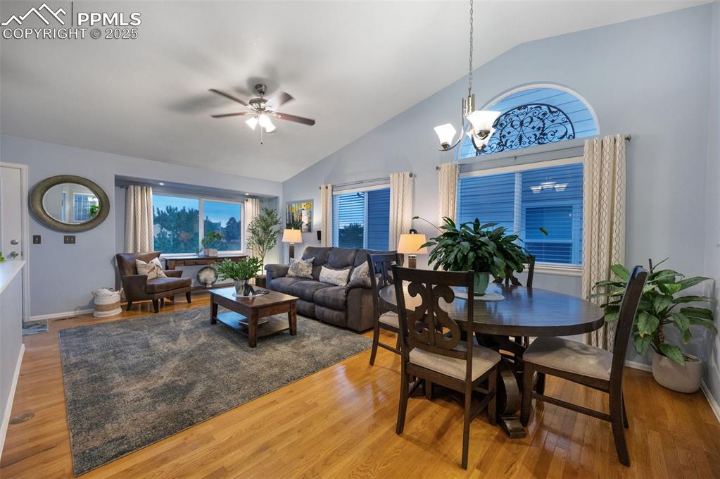 6370 Perfect View Colorado Springs, CO 80919 - Photo 4 of 49 a living room with furniture a chandelier and a potted plant