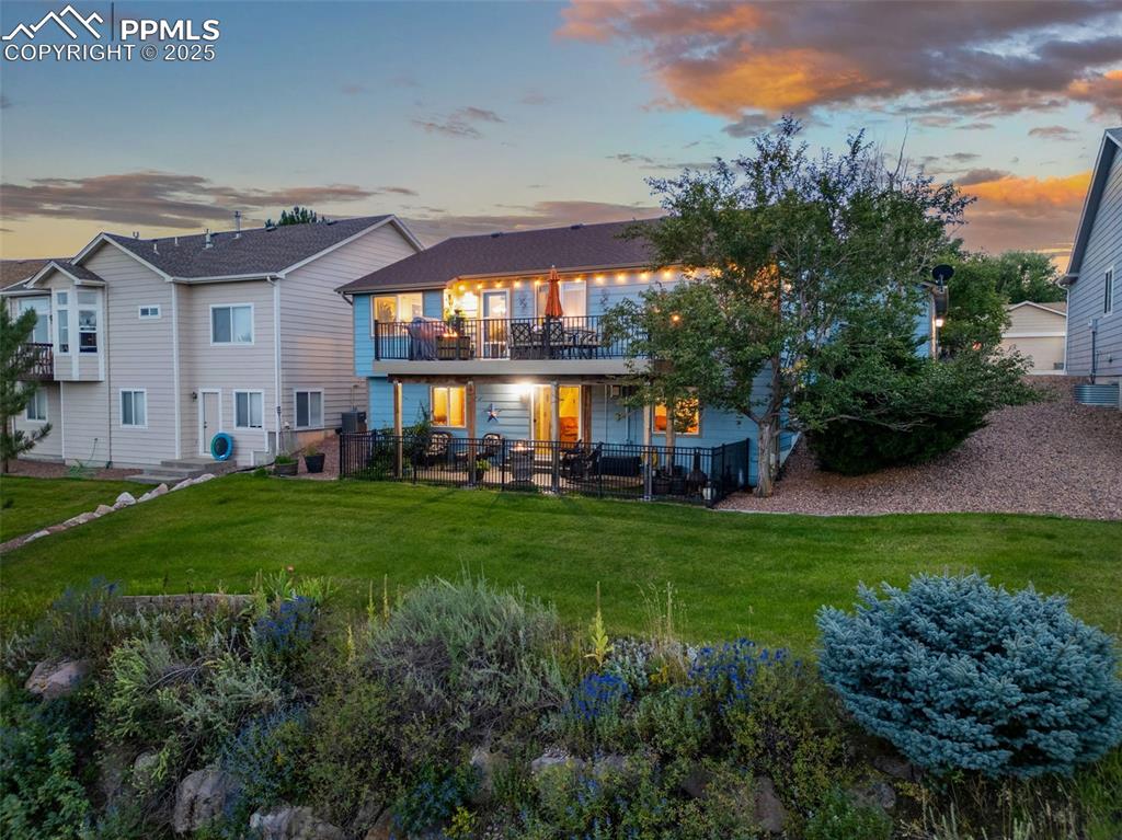 6370 Perfect View Colorado Springs, CO 80919 - Photo 47 of 49 a view of a house with a big yard and potted plants