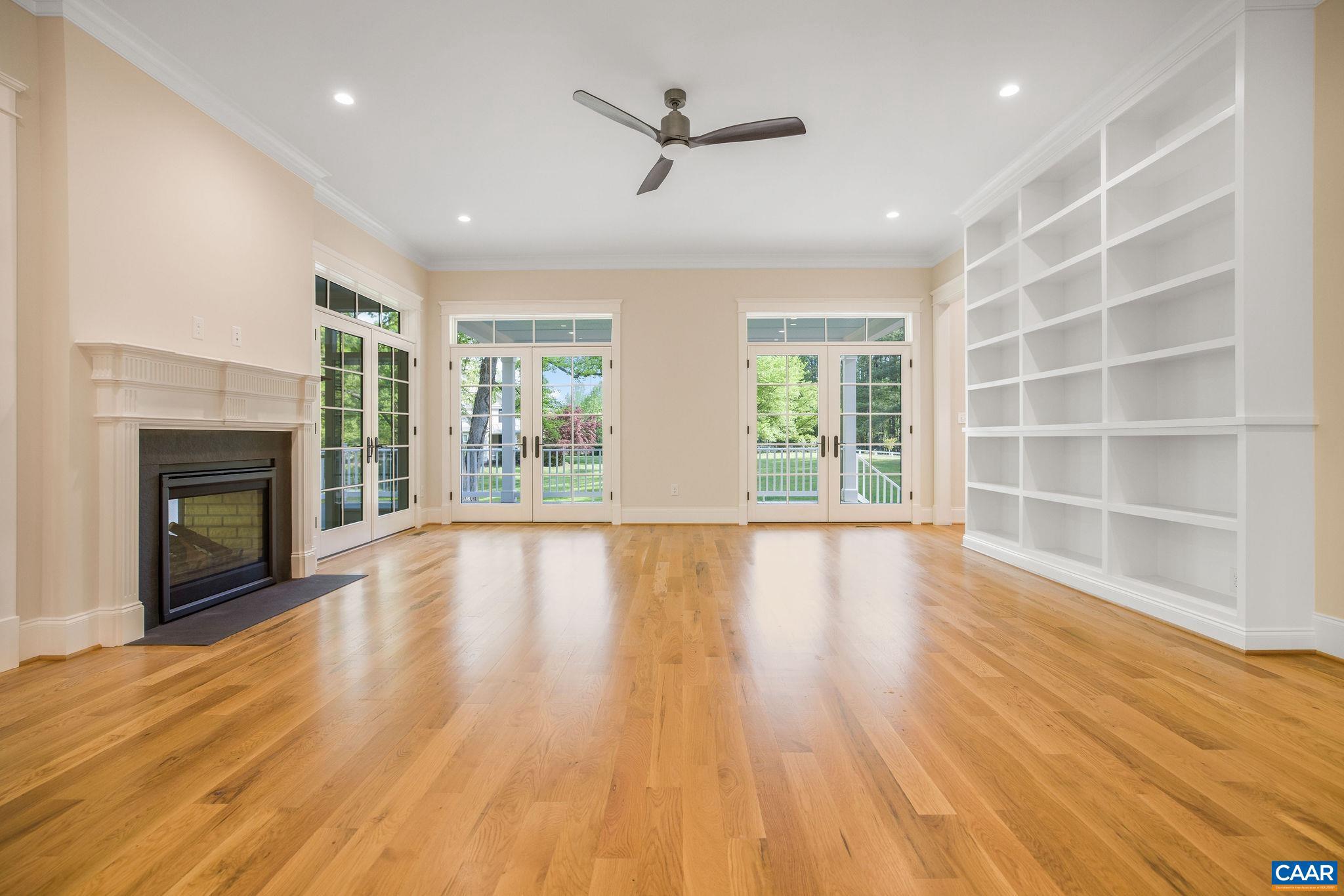 3.12 Acres Tbb Garth Road Charlottesville, VA 22901 - Photo 18 of 52 an empty room with wooden floor fireplace and windows