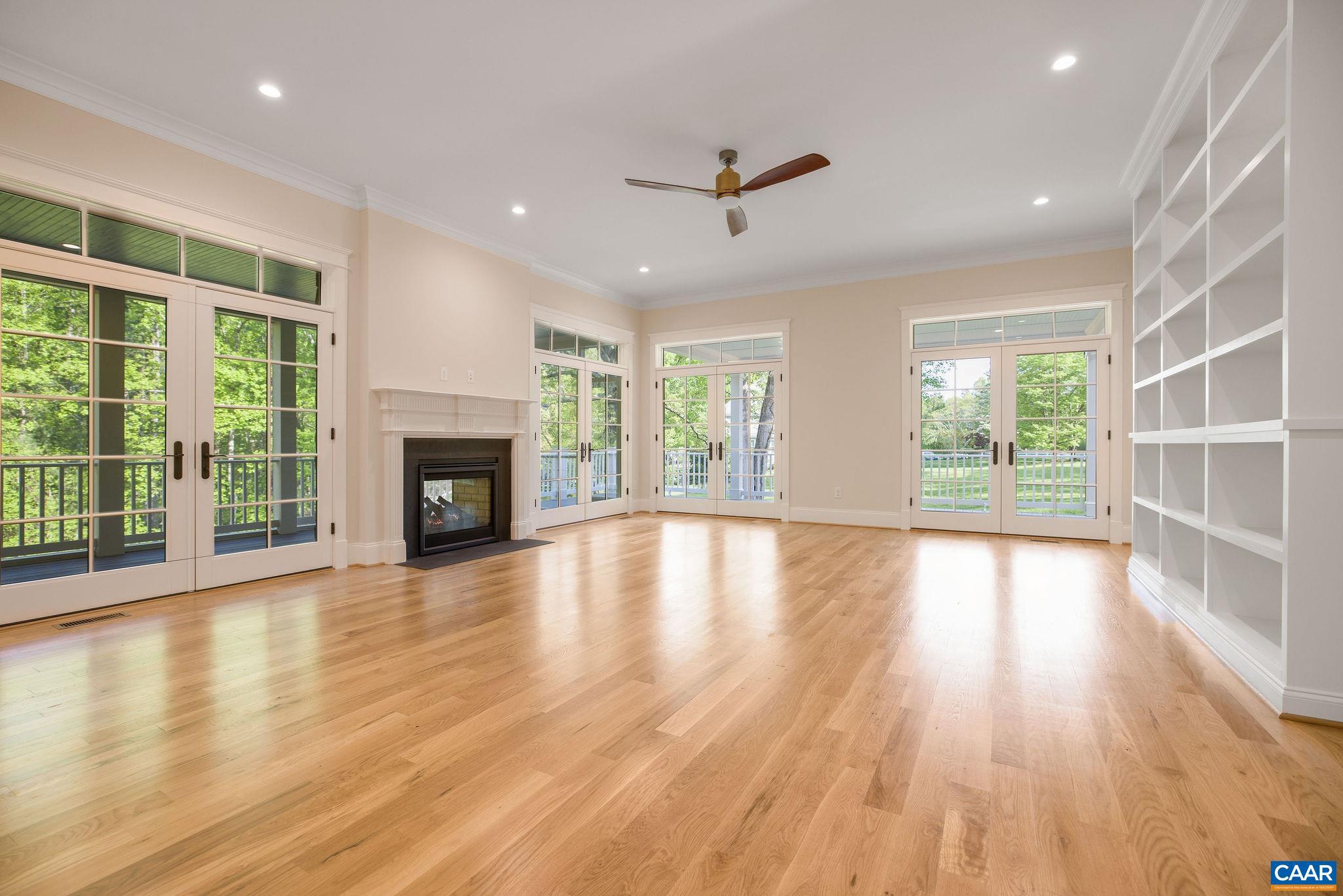 3.12 Acres Tbb Garth Road Charlottesville, VA 22901 - Photo 19 of 52 a view of empty room with wooden floor and fireplace