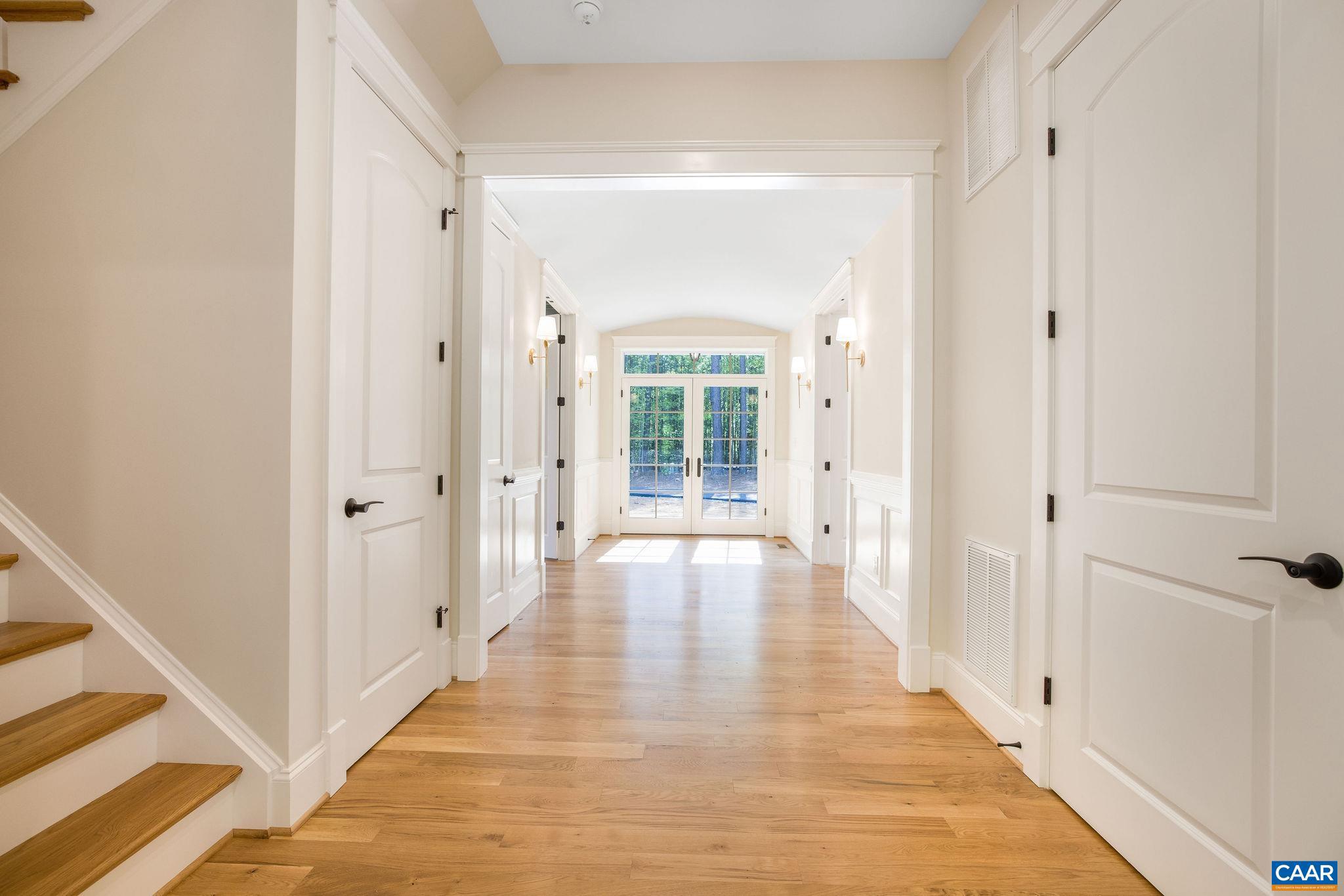 3.12 Acres Tbb Garth Road Charlottesville, VA 22901 - Photo 26 of 52 a view of a hallway with wooden floor and a bathroom