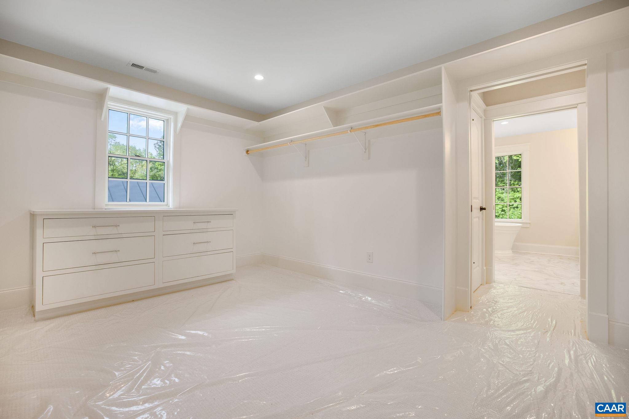 3.12 Acres Tbb Garth Road Charlottesville, VA 22901 - Photo 31 of 52 an empty room with windows and cabinet