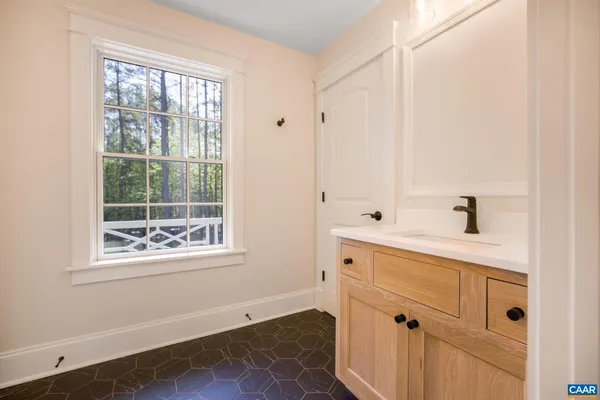 a bathroom with a sink double vanity and a mirror