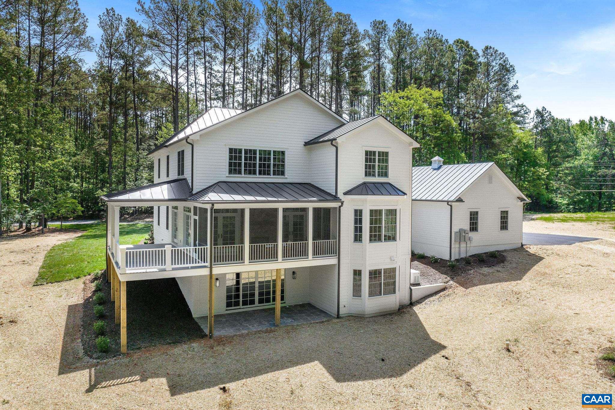 3.12 Acres Tbb Garth Road Charlottesville, VA 22901 - Photo 40 of 52 a front view of a house with a yard and garage