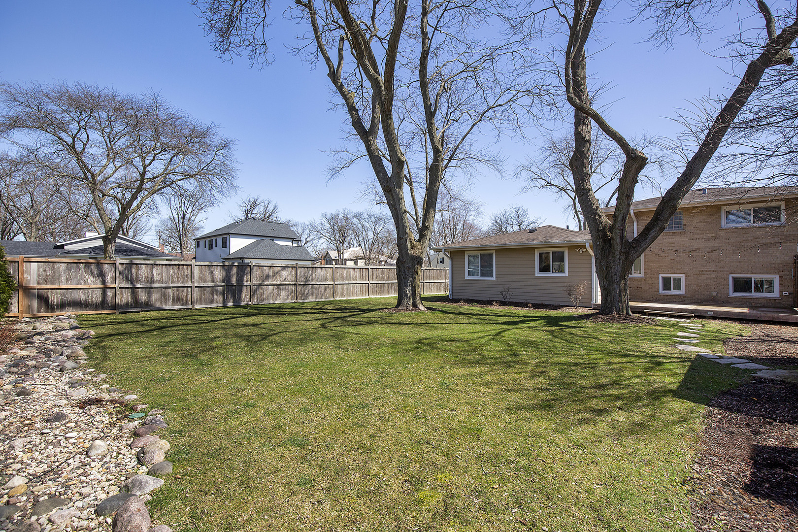 1342 Kenton Road Deerfield, IL 60015 - Photo 11 of 12 a view of a house with a yard