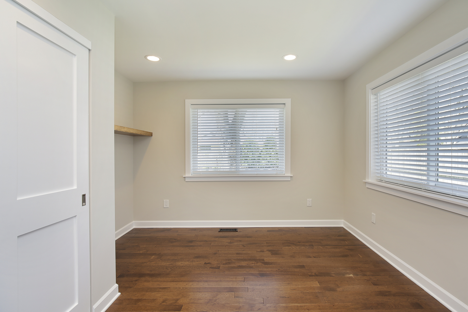 1342 Kenton Road Deerfield, IL 60015 - Photo 4 of 12 a view of an empty room with wooden floor and a window