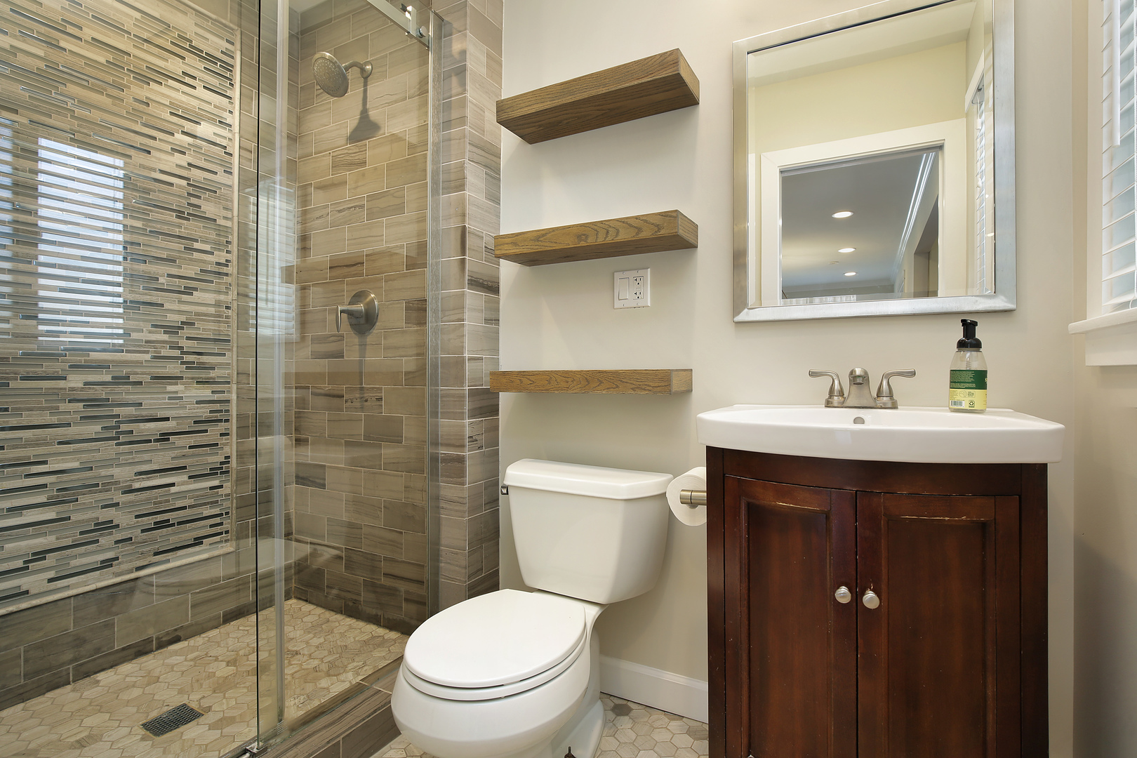 1342 Kenton Road Deerfield, IL 60015 - Photo 6 of 12 a bathroom with a toilet a sink and shower