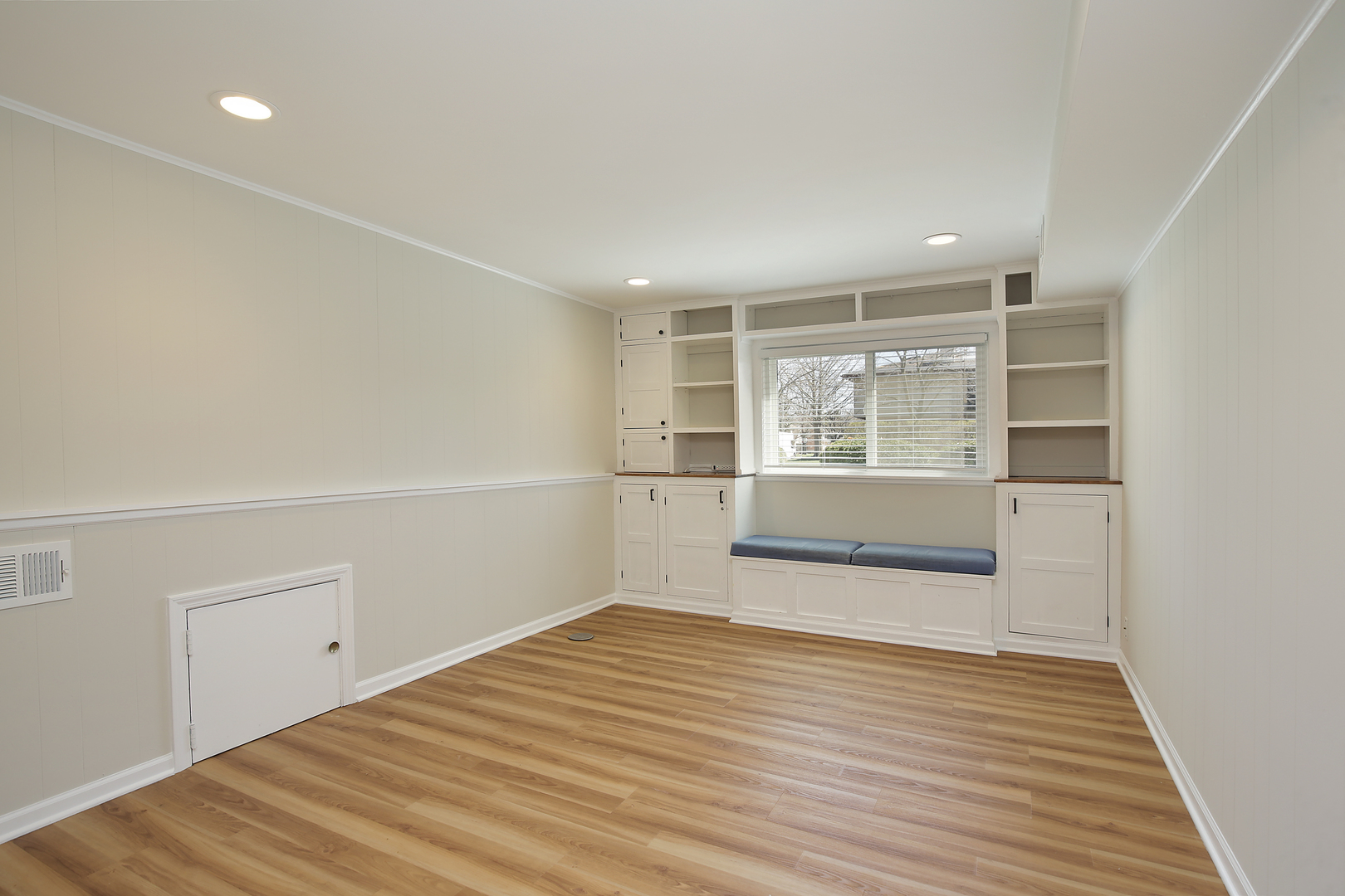 1342 Kenton Road Deerfield, IL 60015 - Photo 9 of 12 a view of a room with wooden floor and white walls