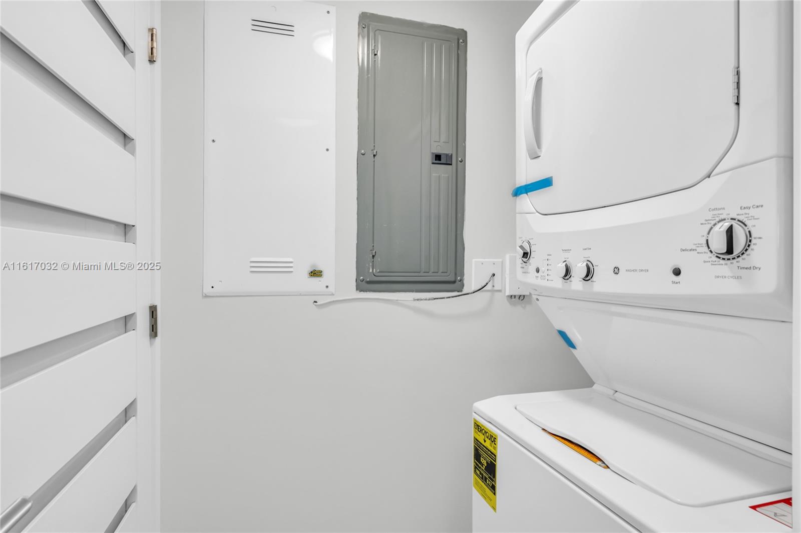 18911 Collins Avenue, Unit 1003 Sunny Isles Beach, FL 33160 - Photo 11 of 47 a utility room with dryer and washer