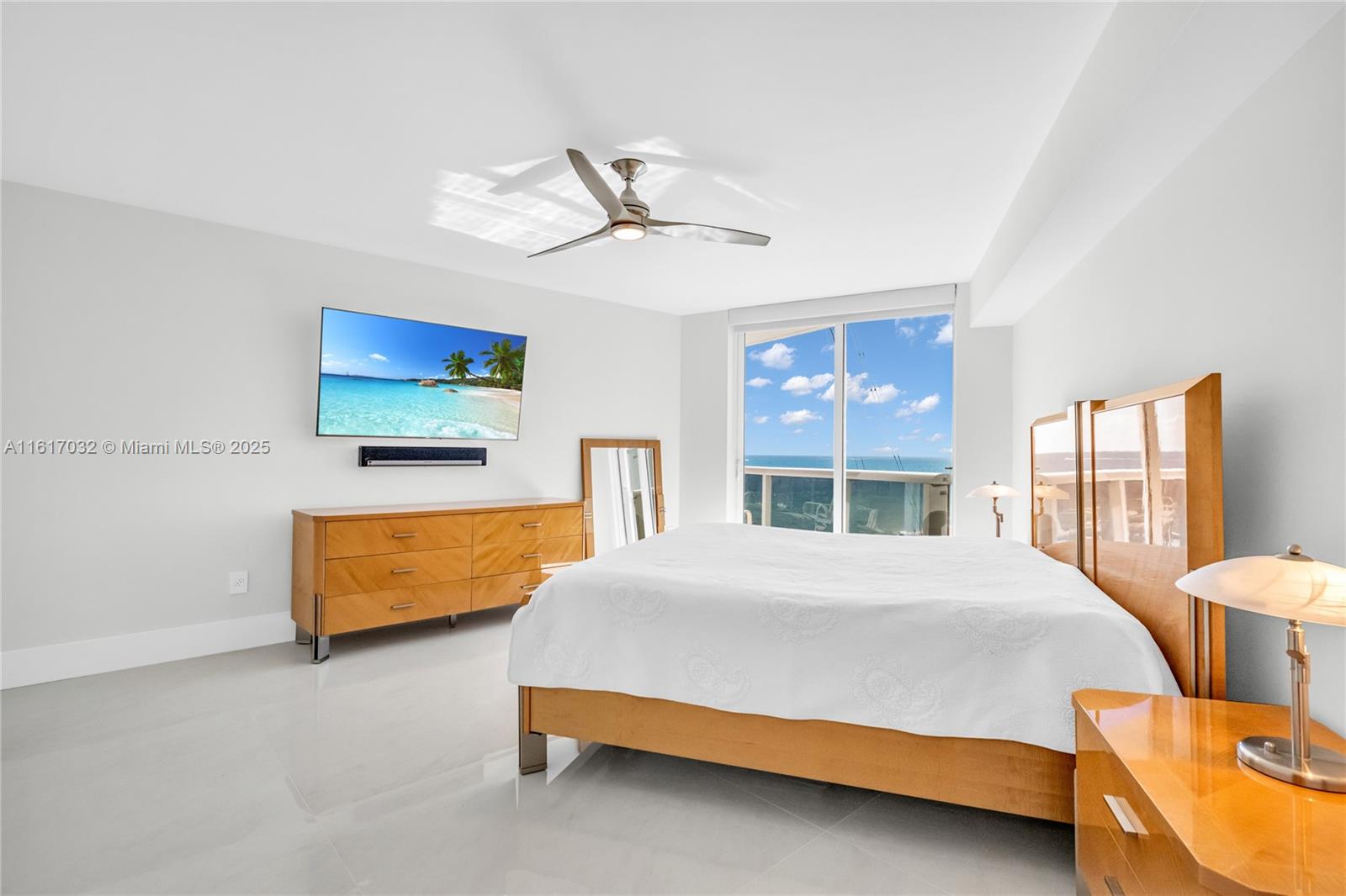 18911 Collins Avenue, Unit 1003 Sunny Isles Beach, FL 33160 - Photo 16 of 47 a bedroom with a bed and window