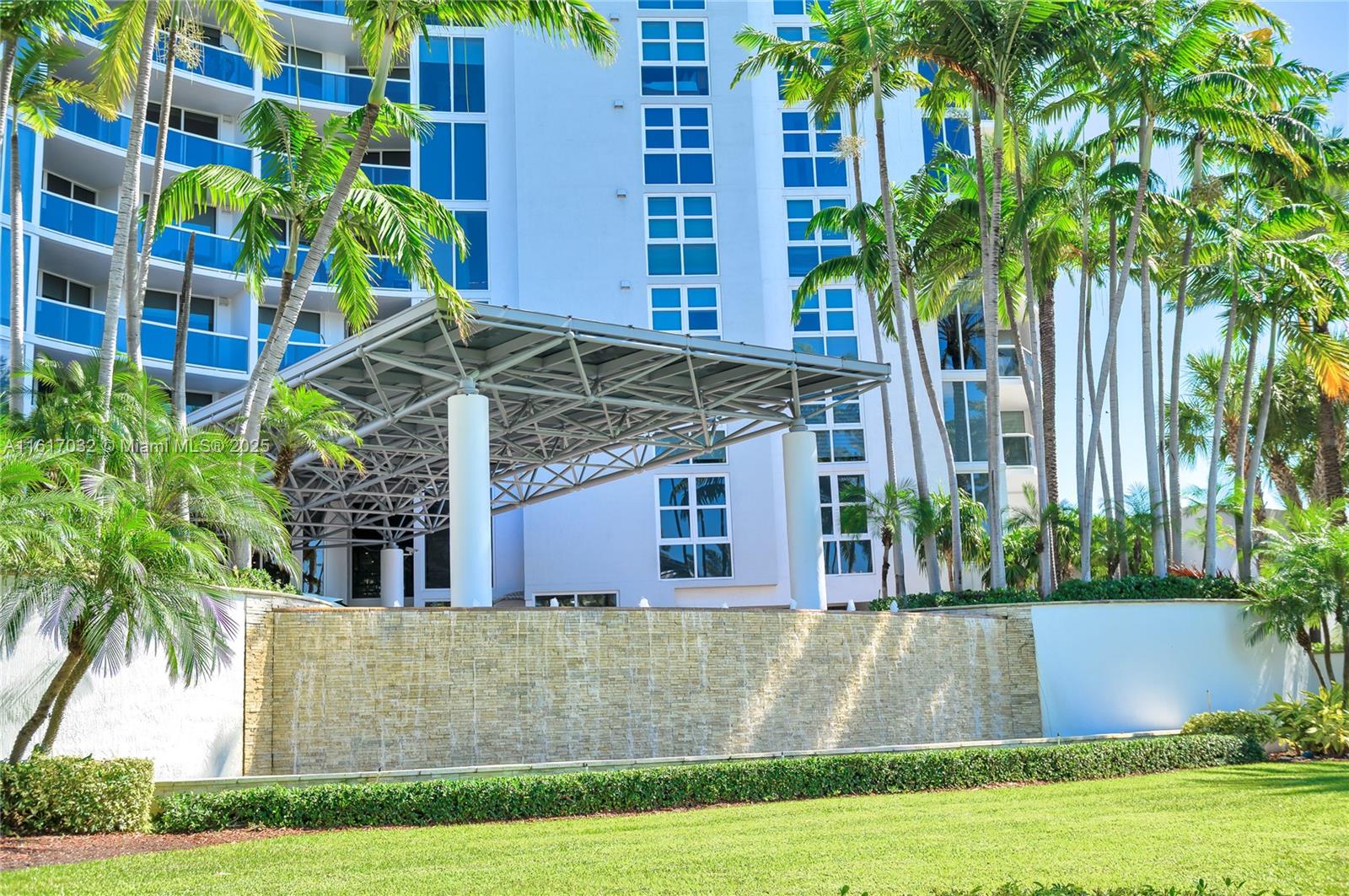 18911 Collins Avenue, Unit 1003 Sunny Isles Beach, FL 33160 - Photo 32 of 47 a front view of building with yard