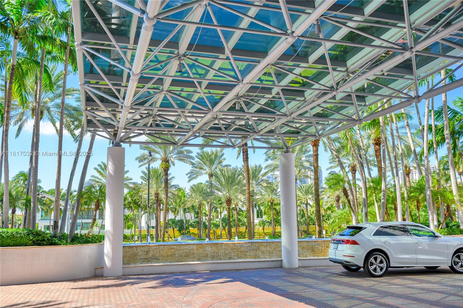18911 Collins Avenue, Unit 1003 Sunny Isles Beach, FL 33160 - Photo 34 of 47 a car parked in front of a house