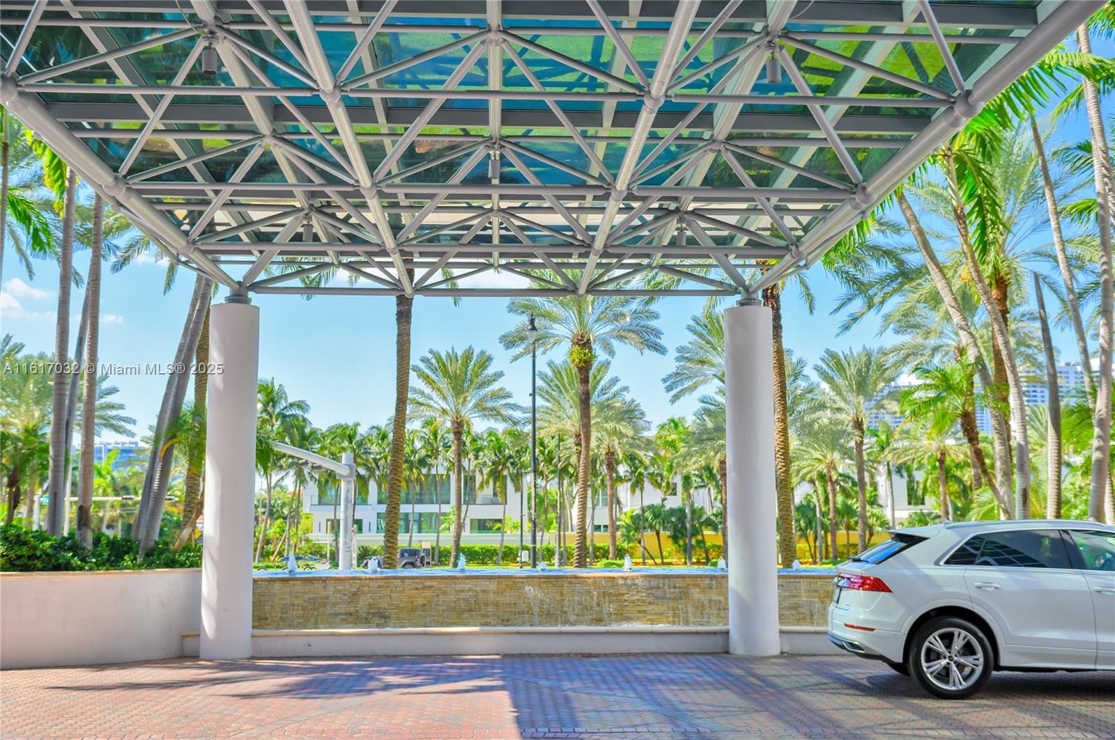 18911 Collins Avenue, Unit 1003 Sunny Isles Beach, FL 33160 - Photo 35 of 47 a car parked in front of a house