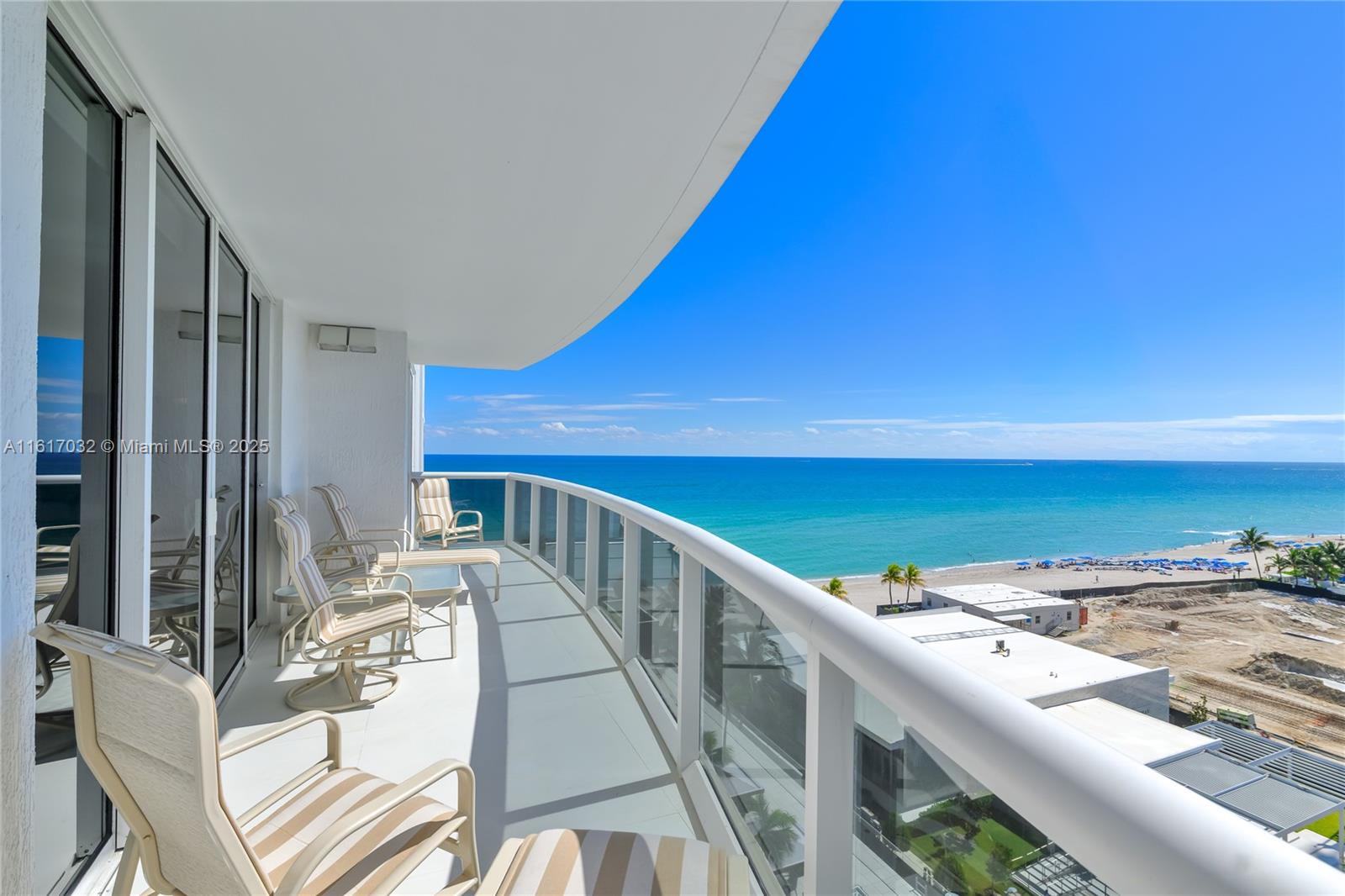18911 Collins Avenue, Unit 1003 Sunny Isles Beach, FL 33160 - Photo 42 of 47 a view of balcony with two chairs and a table