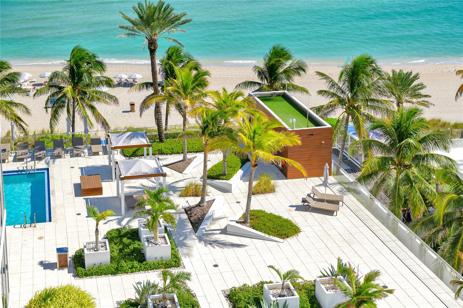 18911 Collins Avenue, Unit 1003 Sunny Isles Beach, FL 33160 - Photo 46 of 47 a view of a house with a yard