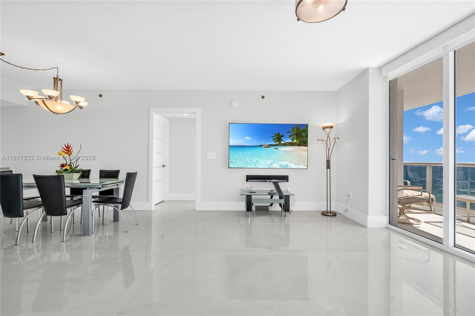18911 Collins Avenue, Unit 1003 Sunny Isles Beach, FL 33160 - Photo 8 of 47 a view of a dining room with furniture
