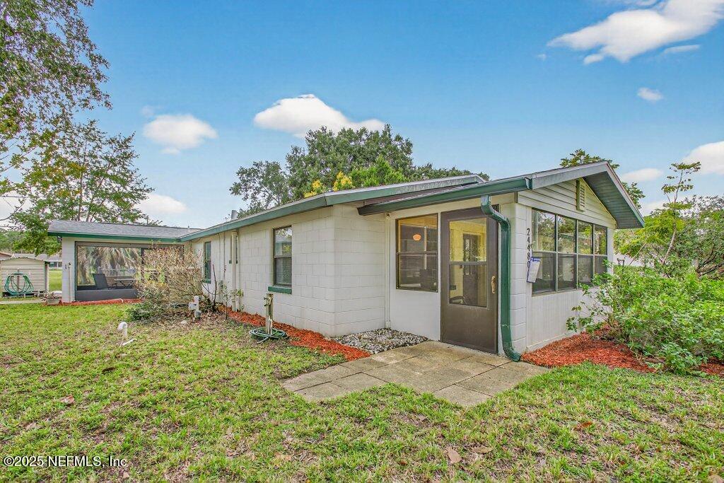 24480 Northeast 127 Street Salt Springs, FL 32134 - Photo 11 of 59 a view of a house with yard and plants
