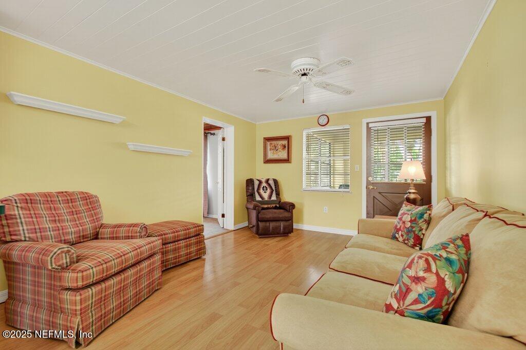 24480 Northeast 127 Street Salt Springs, FL 32134 - Photo 16 of 59 a living room with furniture and a couch