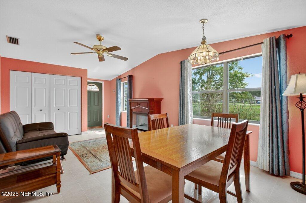 24480 Northeast 127 Street Salt Springs, FL 32134 - Photo 21 of 59 a view of a dining room with furniture window and outside view