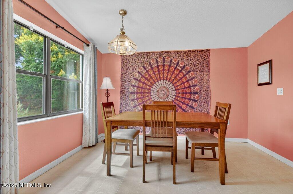 24480 Northeast 127 Street Salt Springs, FL 32134 - Photo 22 of 59 a view of a dining room with furniture window and outside view