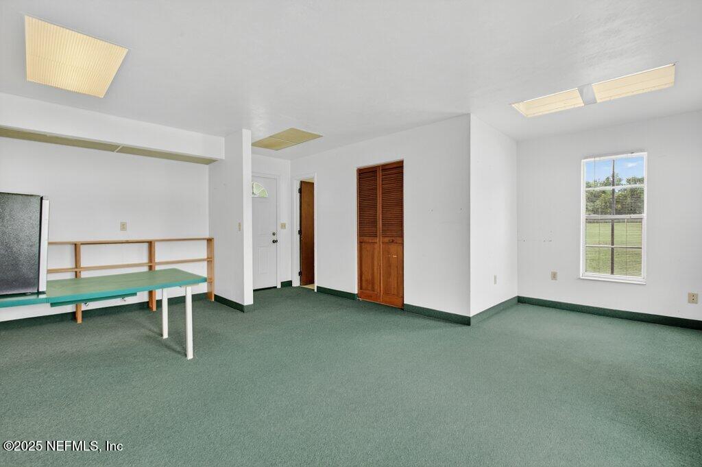 24480 Northeast 127 Street Salt Springs, FL 32134 - Photo 45 of 59 a view of an empty room with a window