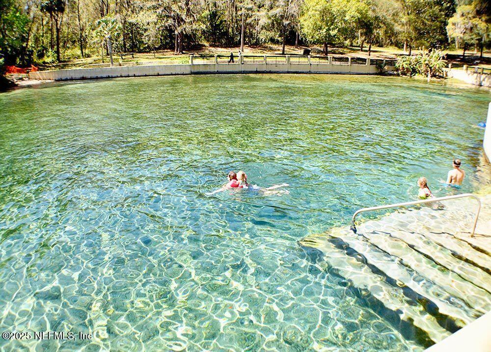 24480 Northeast 127 Street Salt Springs, FL 32134 - Photo 55 of 59 a swimming pool with outdoor space and seating area