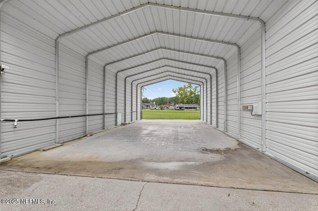 24480 Northeast 127 Street Salt Springs, FL 32134 - Photo 6 of 59 a front view of a house with a garage