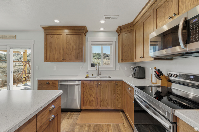 18573 South Marsh Valley Road Downey, ID 83234 - Photo 11 of 32 Kitchen featuring stainless steel appliances, wood finish cabinets, and recessed lighting