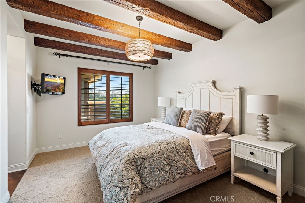 5 Via Monarca Street Dana Point, CA 92629 - Photo 29 of 64 a bedroom with a bed and a window