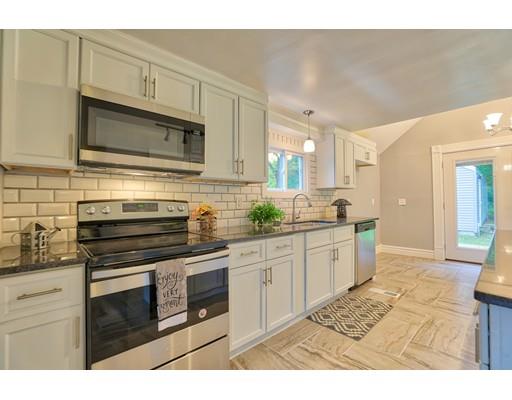 54 Ames Road Hampden, MA 01036 - Photo 6 of 16 a kitchen with stainless steel appliances kitchen island granite countertop a stove a sink and a microwave