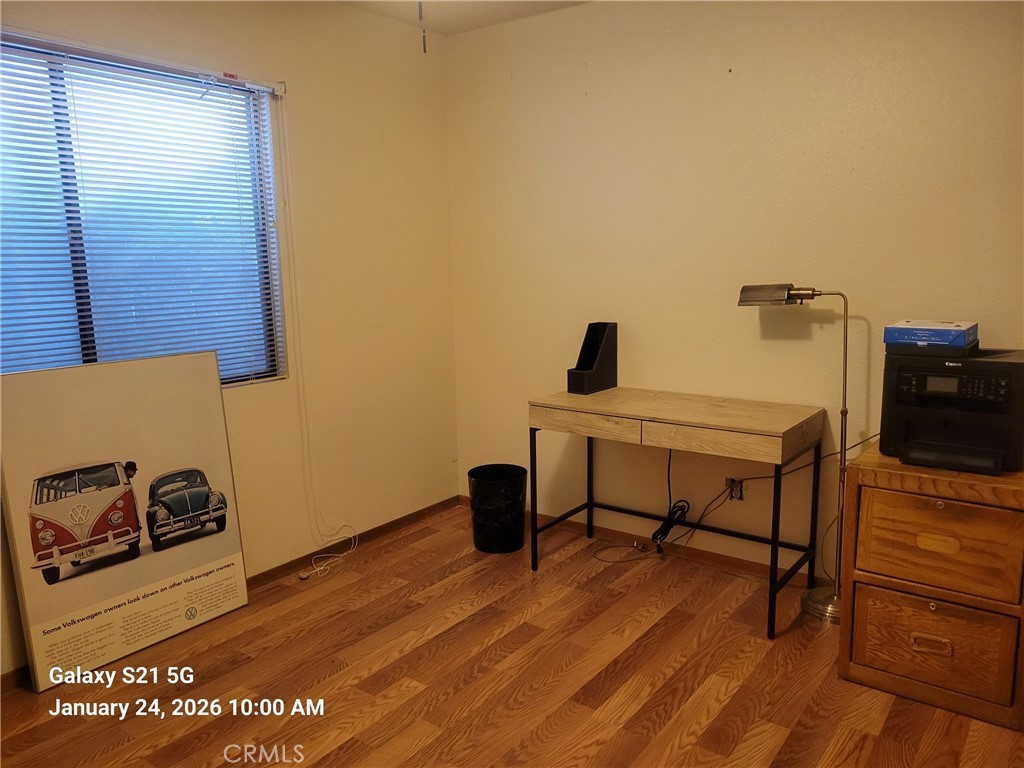 41367 Shadow Palm Way Hemet, CA 92544 - Photo 9 of 35 a view of a workspace with furniture and wooden floor