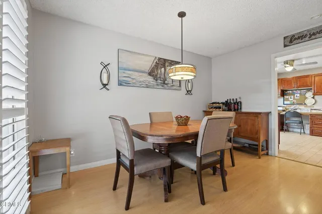 a dining room with furniture and window