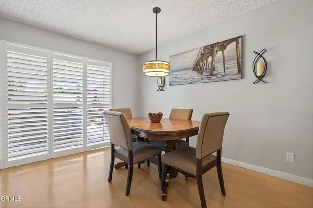 a kitchen with kitchen island granite countertop a sink stove and refrigerator