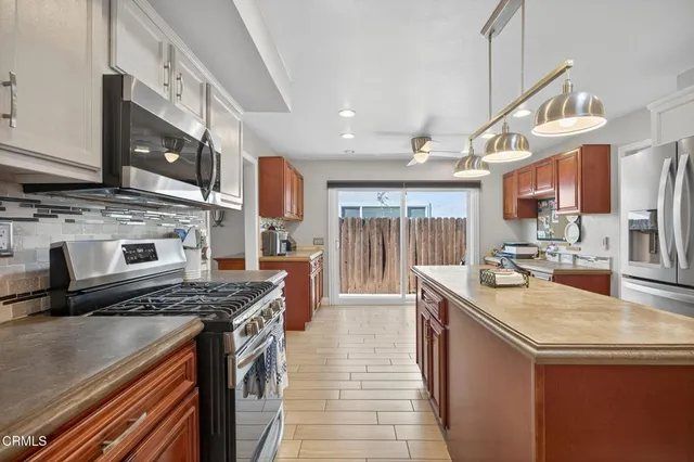 a kitchen with a stove and cabinets