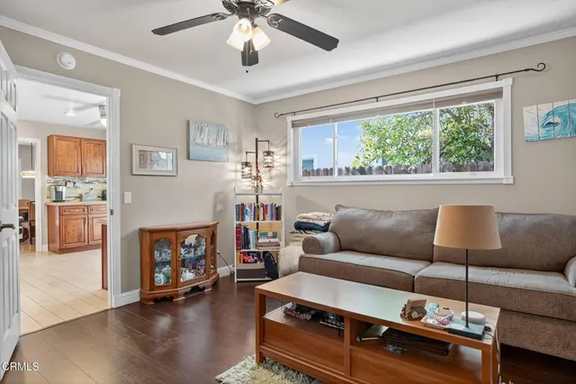 a bathroom with a granite countertop sink a mirror and shower