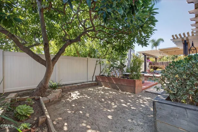 a backyard of a house with outdoor seating