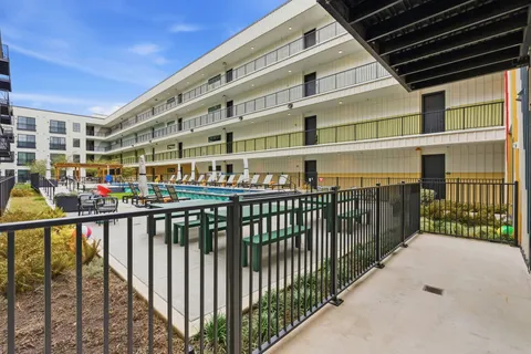 a view of a balcony with many windows