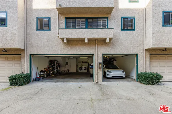 a front view of a house with parking