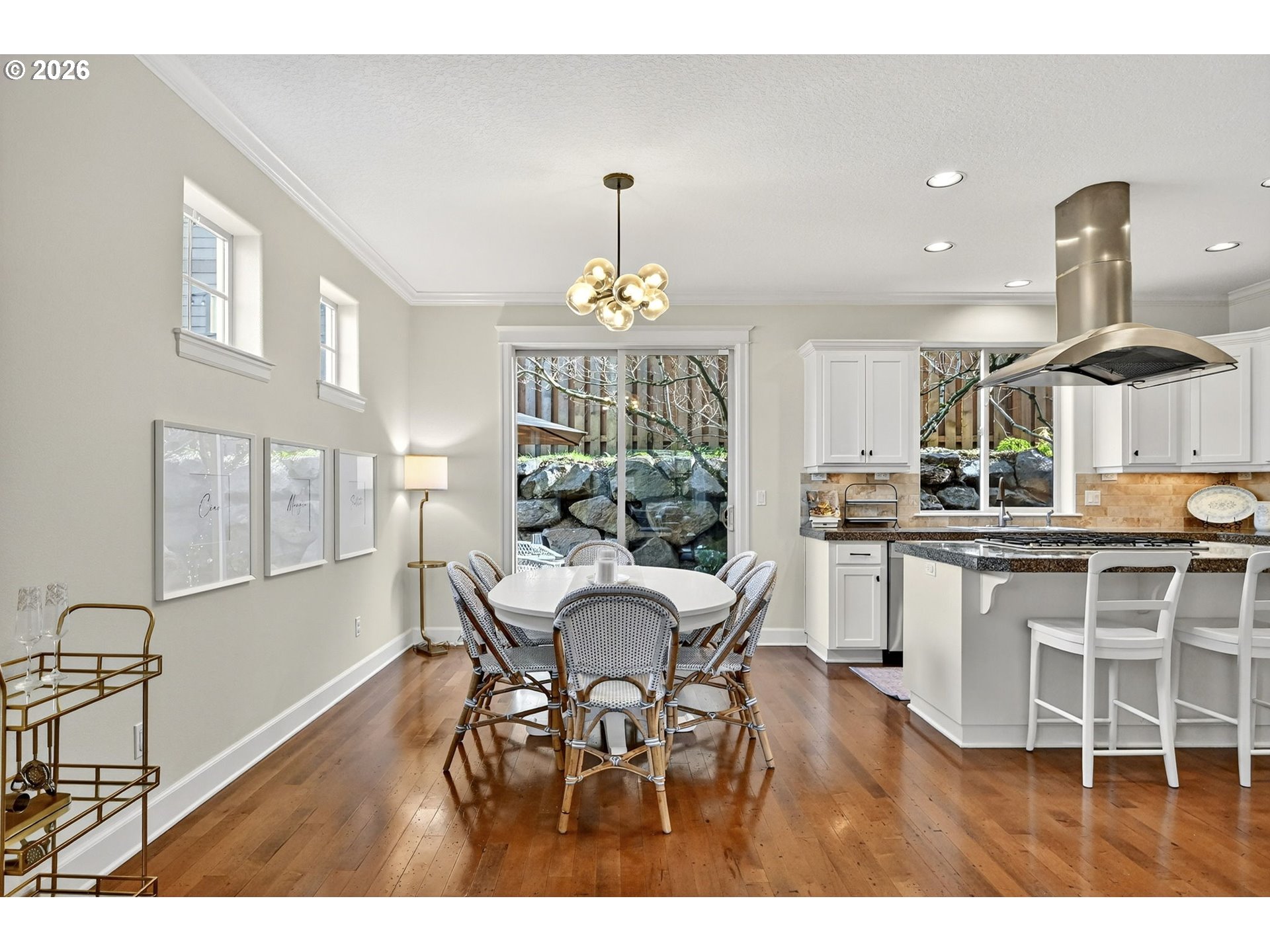 2064 Northwest Village Circle, Unit 44 Portland, OR 97229 - Photo 11 of 45 a view of a dining room with furniture and chandelier